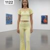 Chic Grommet Detail Two-Piece Set with Flared Pants