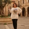 tg_1ac0c1d57a0e9e65 Premium Cream Graphic Blouse with Striped Sleeves